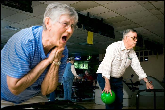 091509_seniorsbowling_strupp E "We tied!" yells 78-year-old Barbara Leastman to her friend Joann Gilbertson as Senior Center resident Dean Turley, 69, prepares to bowl in the background. "I love these people," said Leastman. "It's just like being in one big family."